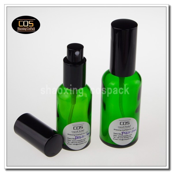 green colored spray bottles glass